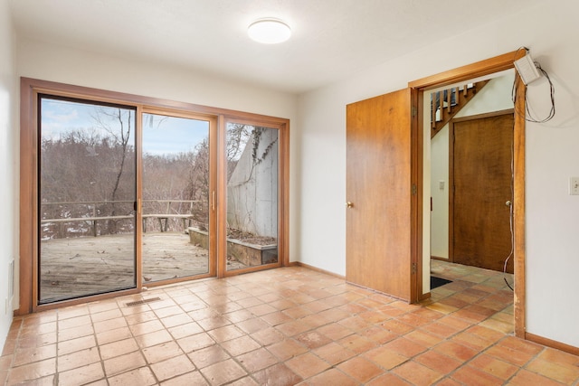 entryway with visible vents and baseboards