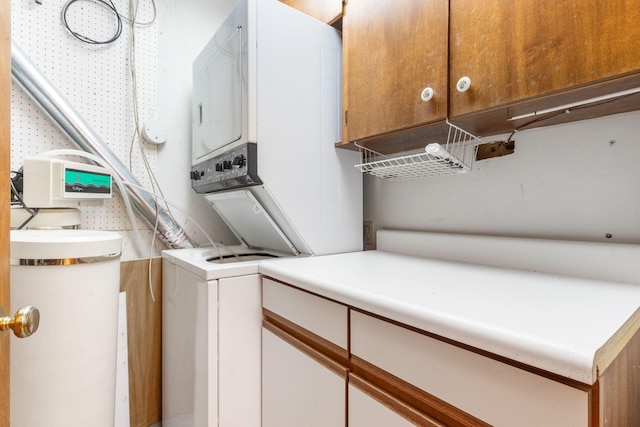 laundry area featuring stacked washer and dryer