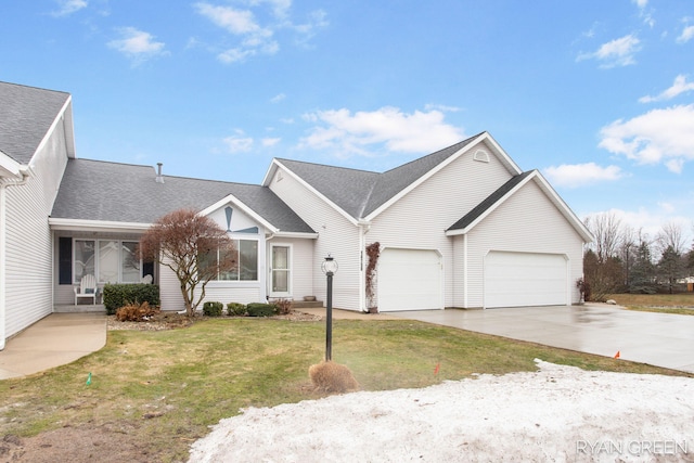 view of front of home with concrete driveway, a front lawn, and roof with shingles