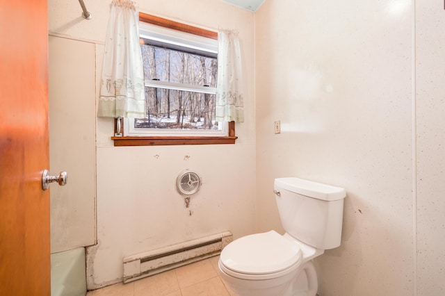 bathroom featuring tile patterned floors, baseboard heating, and toilet