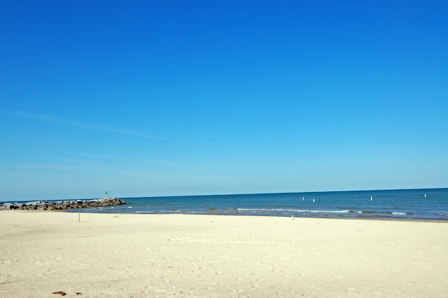 property view of water featuring a beach view