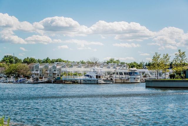 view of water feature with a dock and a residential view