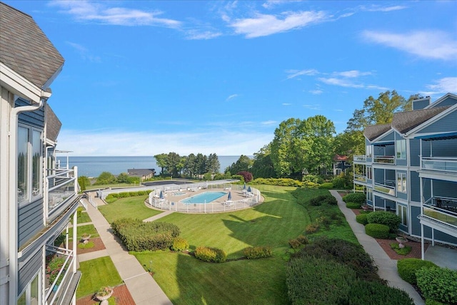 4144 Ridge Rd Unit 16, Stevensville, MI 49127 - view of swimming pool with a water view and a yard