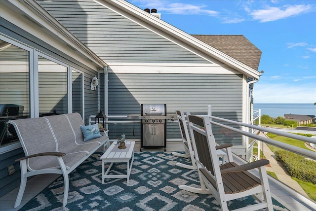 4144 Ridge Rd Unit 16, Stevensville, MI 49127 - view of patio featuring a water view and a grill