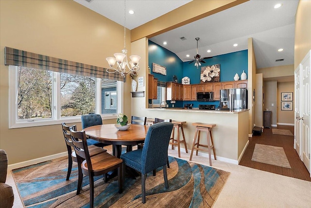 4144 Ridge Rd Unit 16, Stevensville, MI 49127 - dining room featuring a chandelier, recessed lighting, baseboards, high vaulted ceiling, and a ceiling fan