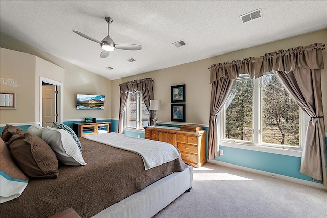 4144 Ridge Rd Unit 16, Stevensville, MI 49127 - carpeted bedroom with multiple windows, vaulted ceiling, baseboards, a textured ceiling, and a ceiling fan