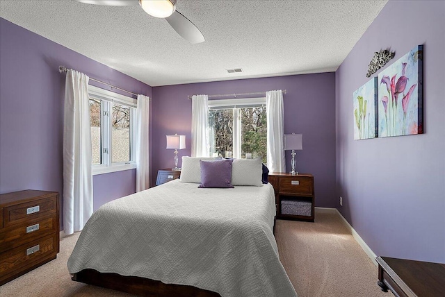 4144 Ridge Rd Unit 16, Stevensville, MI 49127 - bedroom with carpet, a textured ceiling, a ceiling fan, and baseboards