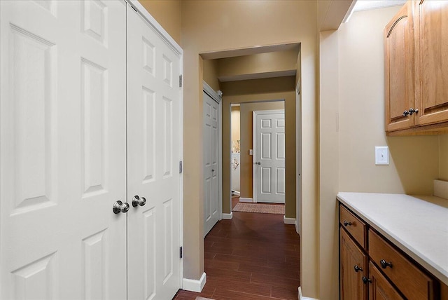 4144 Ridge Rd Unit 16, Stevensville, MI 49127 - hallway featuring baseboards and dark wood finished floors