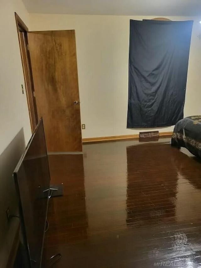 bedroom with wood finished floors