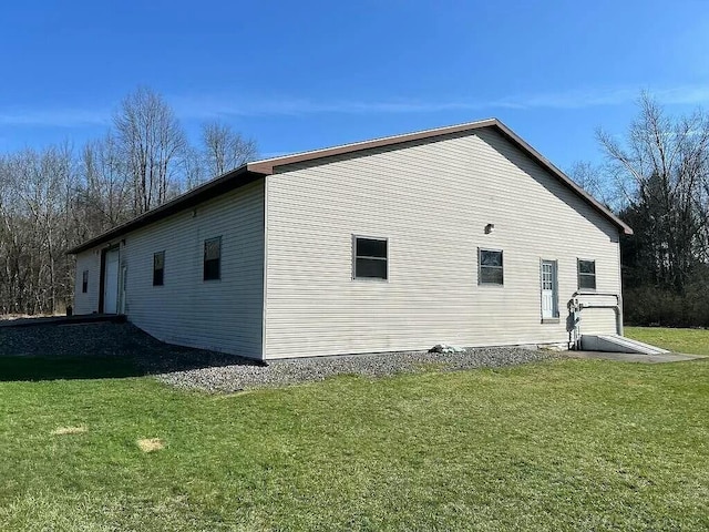 view of home's exterior featuring a lawn