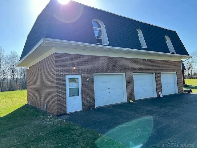 garage featuring driveway