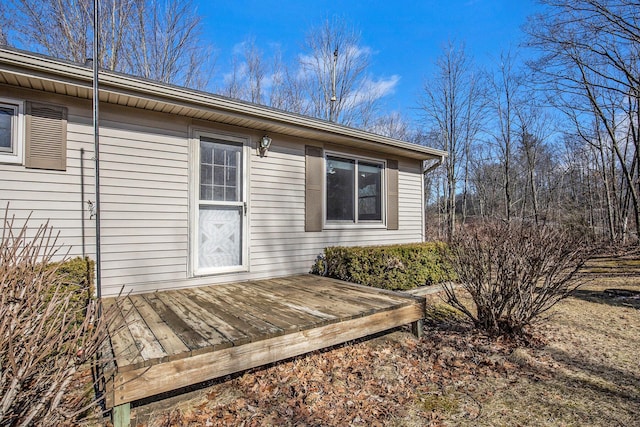 property entrance with a wooden deck