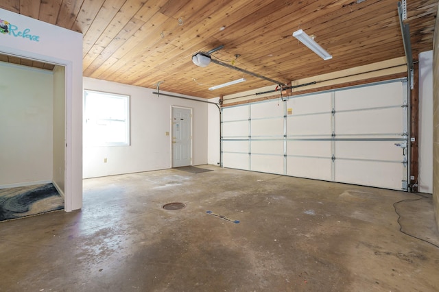 garage with a garage door opener and wood ceiling