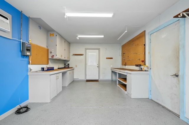 kitchen featuring light countertops and white cabinets