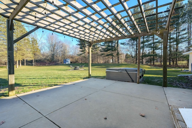 view of patio with a hot tub and a pergola