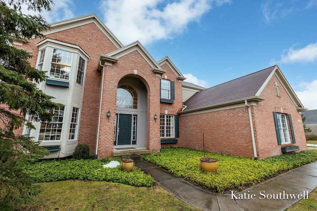 traditional home with brick siding