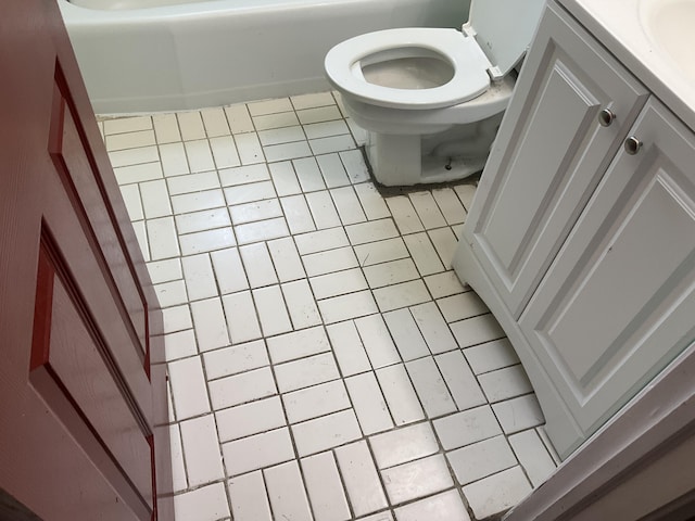 bathroom featuring toilet, tile patterned flooring, and vanity