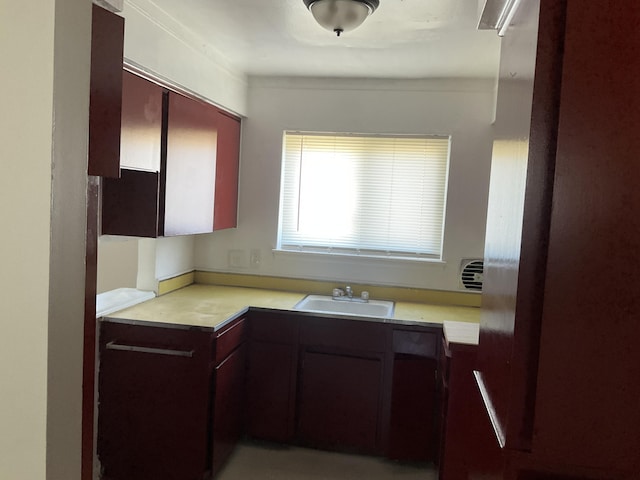 kitchen with light countertops and a sink