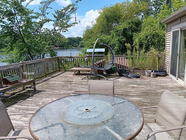 wooden deck with a water view