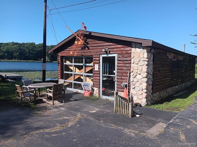 view of outbuilding with a water view