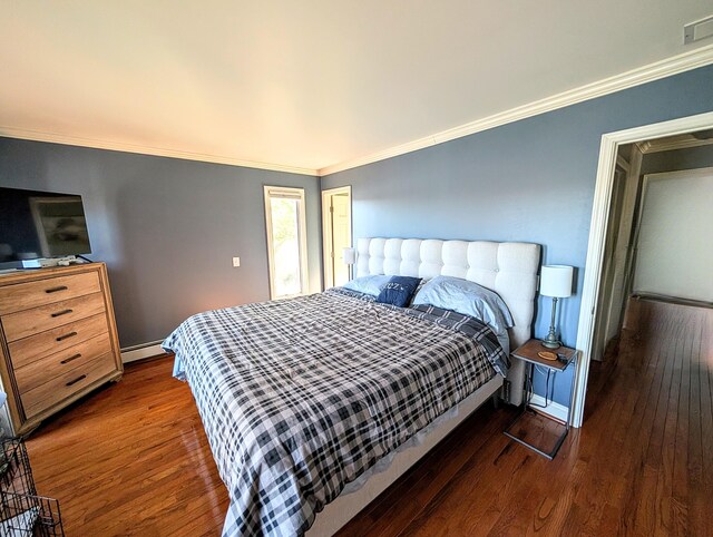 5007 S 42nd St, Climax, MI 49034 - bedroom featuring wood finished floors, crown molding, a baseboard radiator, and baseboards