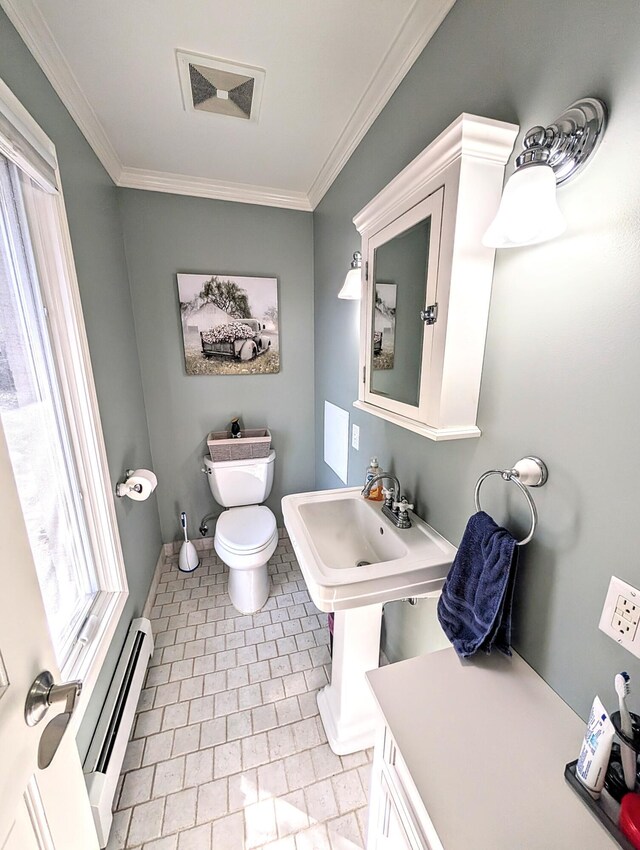 5007 S 42nd St, Climax, MI 49034 - bathroom featuring a baseboard radiator, toilet, and crown molding