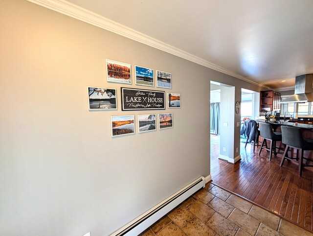 5007 S 42nd St, Climax, MI 49034 - hall with crown molding, baseboards, stone tile flooring, and a sink