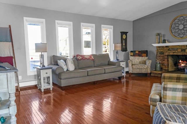 5007 S 42nd St, Climax, MI 49034 - living room with wood-type flooring, healthy amount of natural light, vaulted ceiling, a fireplace, and a baseboard heating unit