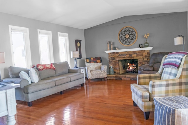 5007 S 42nd St, Climax, MI 49034 - living room with wood finished floors, lofted ceiling, and a stone fireplace