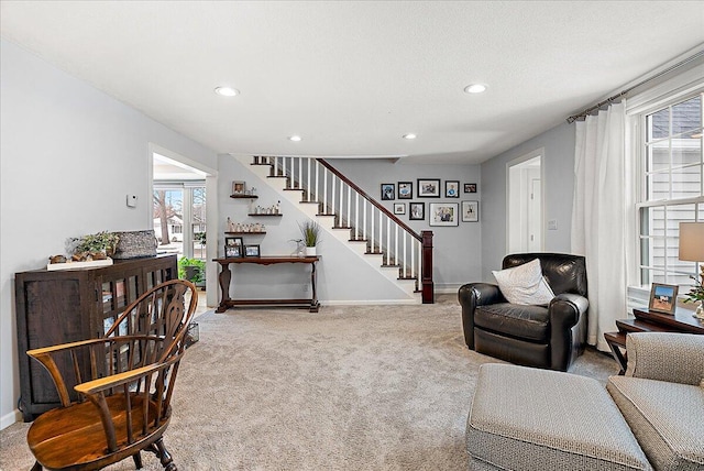 living area with stairs, carpet floors, recessed lighting, and baseboards