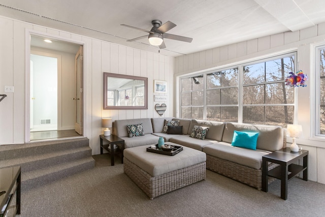 sunroom featuring visible vents and a ceiling fan