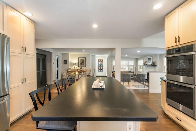 dining room featuring recessed lighting and dark wood-type flooring