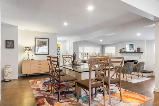 dining area featuring recessed lighting, a brick fireplace, and dark wood-style flooring