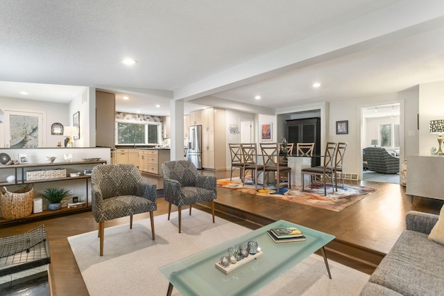 living area featuring recessed lighting and wood finished floors