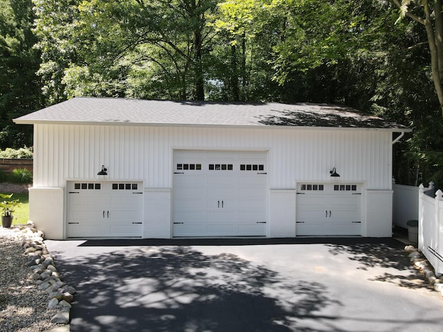 detached garage with fence