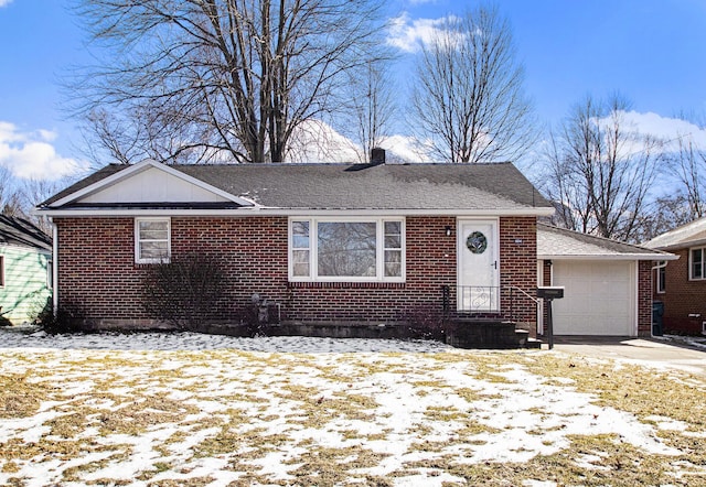 view of front of property with brick siding, a chimney, a shingled roof, concrete driveway, and an attached garage