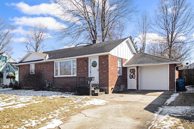 view of front of property featuring brick siding, driveway, roof with shingles, board and batten siding, and a chimney