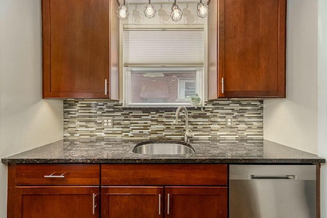 kitchen with dishwasher, tasteful backsplash, dark stone counters, and a sink