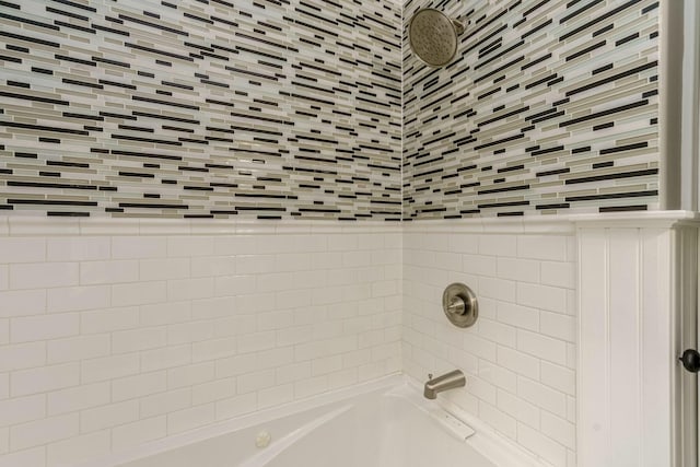 bathroom with washtub / shower combination