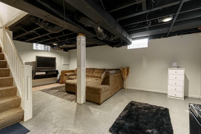 basement with stairway and baseboards