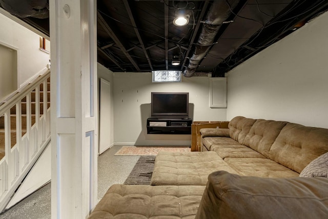 living room with stairs and speckled floor