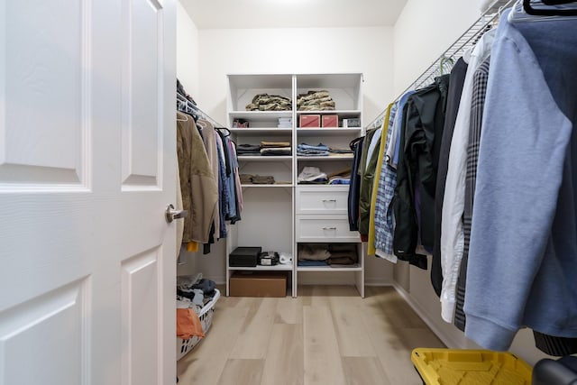 walk in closet featuring light wood-type flooring