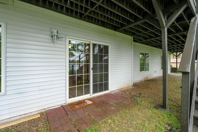 view of side of home with a patio area