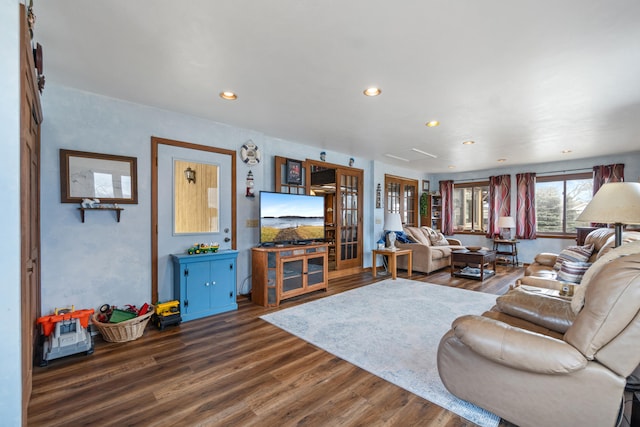 living room with wood finished floors and recessed lighting