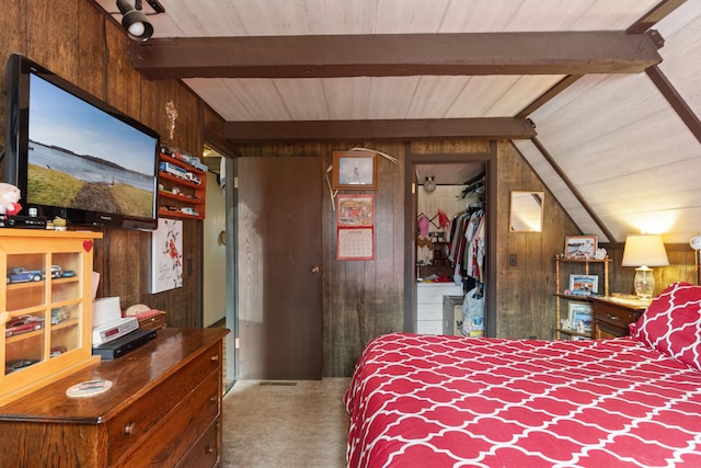 carpeted bedroom featuring lofted ceiling with beams, wood walls, and wood ceiling