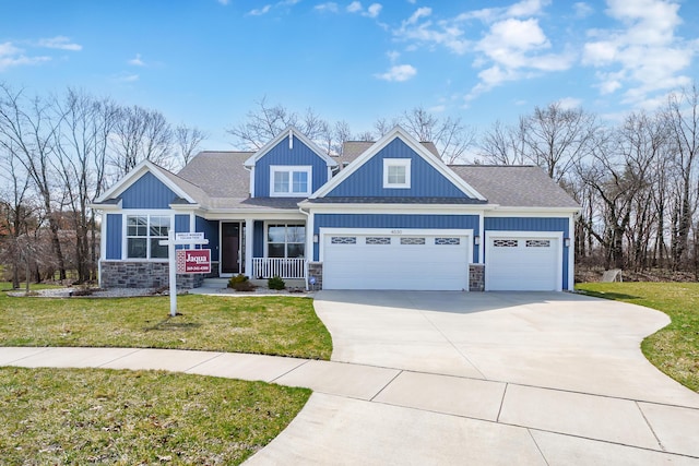 4030 Hollow Wood Dr, Portage, MI 49024 - craftsman house with stone siding, driveway, a front lawn, a porch, and a garage