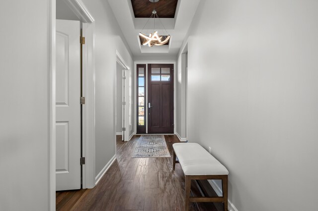 4030 Hollow Wood Dr, Portage, MI 49024 - entryway featuring a raised ceiling, baseboards, and dark wood finished floors