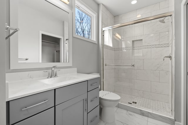 4030 Hollow Wood Dr, Portage, MI 49024 - full bath with marble finish floor, toilet, a stall shower, and vanity