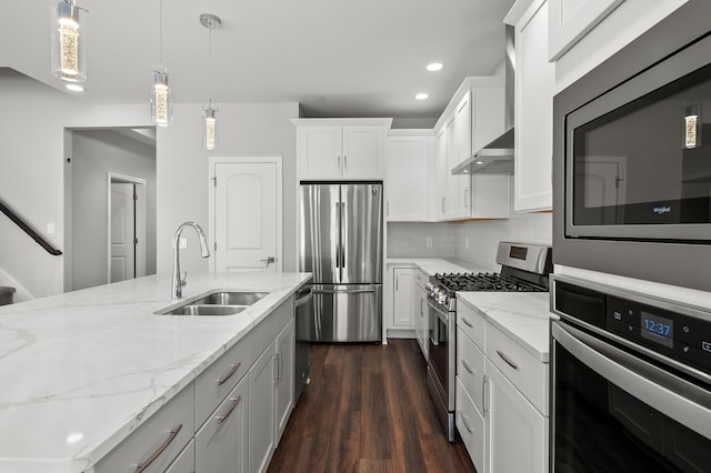 4030 Hollow Wood Dr, Portage, MI 49024 - kitchen featuring a sink, pendant lighting, white cabinetry, stainless steel appliances, and dark wood-style flooring