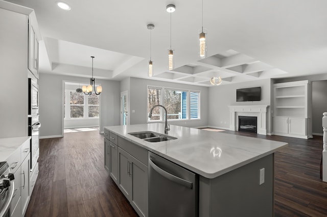 4030 Hollow Wood Dr, Portage, MI 49024 - kitchen featuring open floor plan, a fireplace, a sink, and appliances with stainless steel finishes